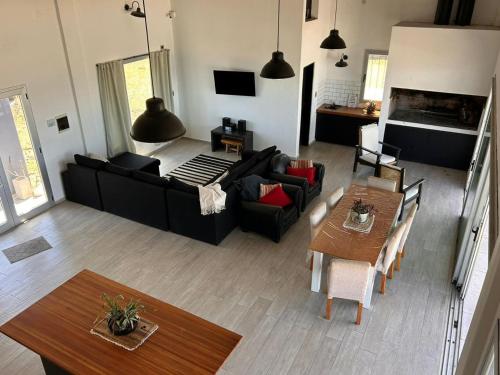 a living room with a black couch and a table at La moradaa in Federación