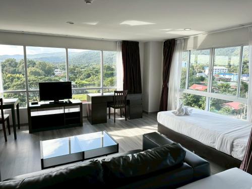 Postel nebo postele na pokoji v ubytování Golden Good Hill Hotel, Chiang Mai