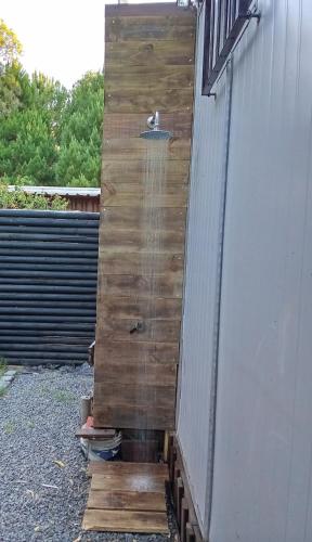 a wooden wall on the side of a building at Tu lugar de relax a 2 cuadras de la playa Se reserva con seña in Guazuvira