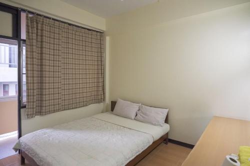 Ένα ή περισσότερα κρεβάτια σε δωμάτιο στο Suriyart Hotel