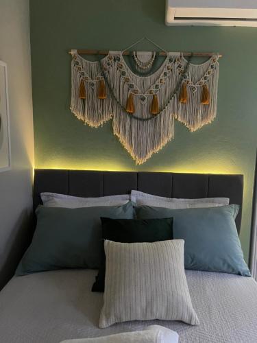 Ένα ή περισσότερα κρεβάτια σε δωμάτιο στο Ótima suíte privada em Torres