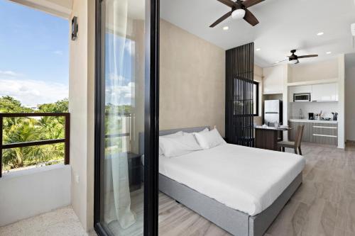 Postel nebo postele na pokoji v ubytování Wayra Condos