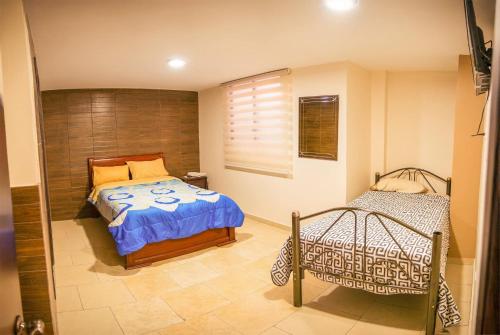 Postel nebo postele na pokoji v ubytování Hospedaje la Cascada