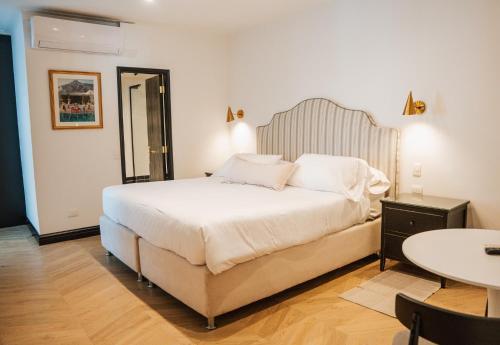 Postel nebo postele na pokoji v ubytování Hotel Marcos Gamero