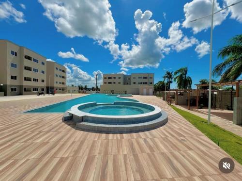 La alberca dentro o cerca de Apartamento com piscina e academia