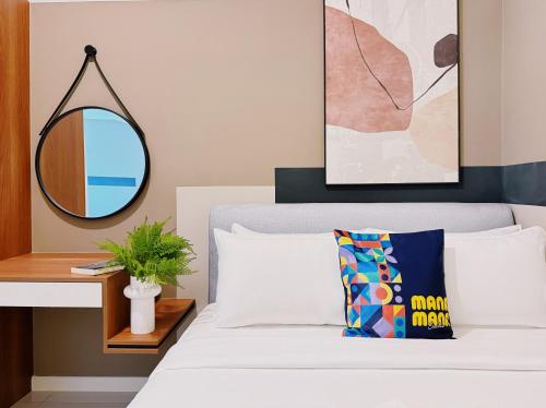 Ένα ή περισσότερα κρεβάτια σε δωμάτιο στο Majestic Suites KLCC by Mana-Mana