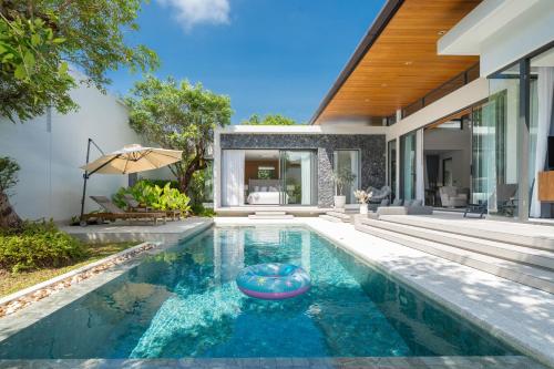 a swimming pool in a house with a house at Villa Beautiful swimming pool in Phuket