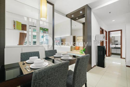 a dining room with a table and chairs at Javen by Kozystay - Thamrin in Jakarta