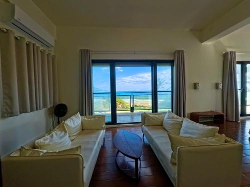 Postel nebo postele na pokoji v ubytování 月伴灣海景民宿MoonBay Seaview Homestay - 半自動入住 Self check-in