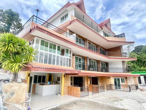 an image of a house at Lucky 9 Airport Hotel Phuket in Nai Yang Beach