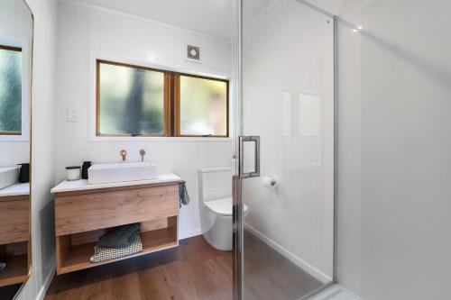 a bathroom with a sink and a shower at Okawa Bay Lakeside - Lake Rotoiti A-Frame in Mourea