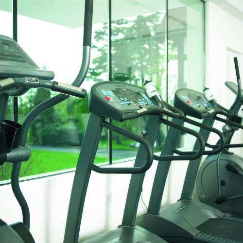 a row of cardio machines in a bus at Woodland Grange in Leamington Spa