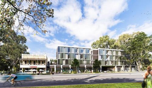 a rendering of a building with a person riding a bike at Urban Rest Hackney Hotel in North Adelaide