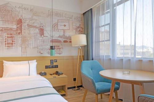 Postel nebo postele na pokoji v ubytování City Comfort Inn Taizhou International Exhibition Center