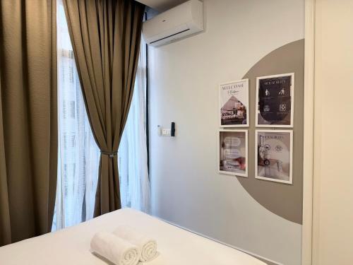 Postel nebo postele na pokoji v ubytování The Shore Kota Kinabalu by BeeHome