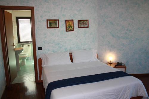 Ein Bett oder Betten in einem Zimmer der Unterkunft Sole della Franciacorta - Hotel & Restaurant