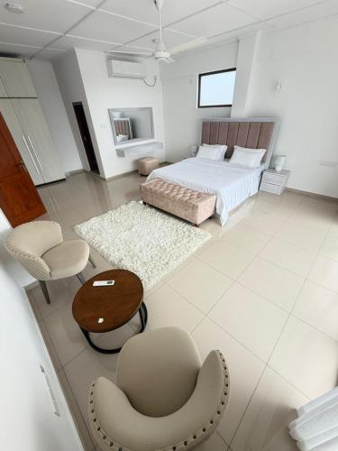 Ένα ή περισσότερα κρεβάτια σε δωμάτιο στο The Altura Apartment