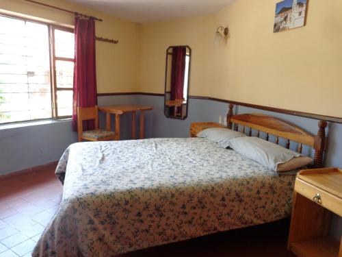 Hostal Pachamamaにあるベッド