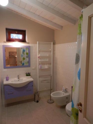 a bathroom with a sink and a toilet at Agriturismo La Corte - Viterbo Terme in Viterbo