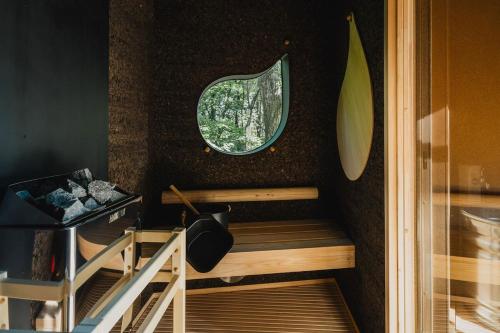 a room with a sauna with a window and a surfboard at SANU 2nd Home 北軽井沢 2nd in Kita-karuizawa