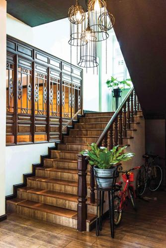 a stairway with two bikes parked next to a staircase at The Bridge Residence Hotel in Kanchanaburi