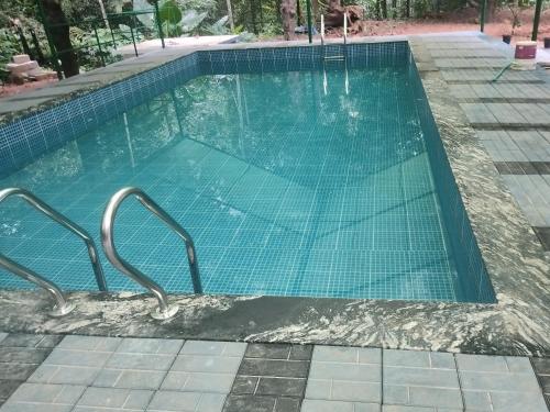 Πισίνα στο ή κοντά στο ETERNA Homestay Rackad