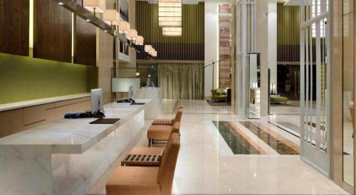 TV a/nebo společenská místnost v ubytování Xiamenair Maple Hotel (Xiamen SM City Plaza)