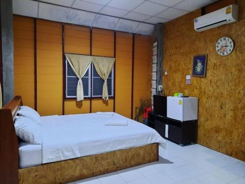 Postel nebo postele na pokoji v ubytování Peisanae Faikeng Resort