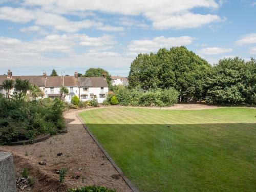 a yard with a large lawn in front of a house at PSF Panorama Apartments in Ashford