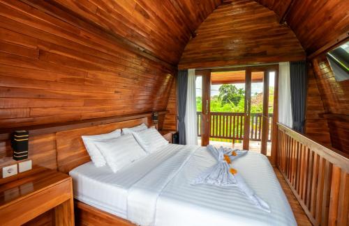 Ένα ή περισσότερα κρεβάτια σε δωμάτιο στο Villa Aditya