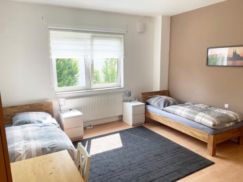Postel nebo postele na pokoji v ubytování Work and Stay Apartment Cologne- Fühlinger See