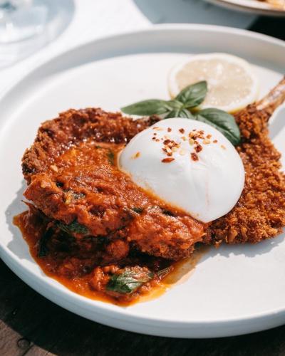 a white plate with a piece of food on it at Issara Boutique Winery Hotel in Muaklek