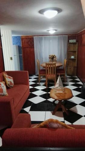 a living room with a couch and a table at Parques de Afunalhue in Licán Ray