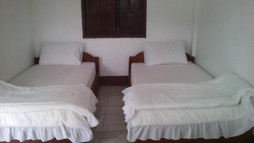 Katil atau katil-katil dalam bilik di Thongdam Guesthouse