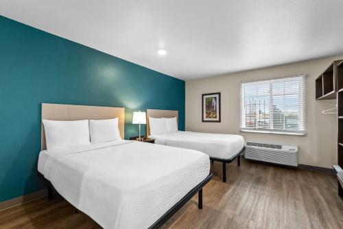 Postel nebo postele na pokoji v ubytování WoodSpring Suites San Antonio South