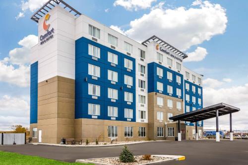 a hotel with a blue and white building at Comfort Inn & Suites in North Battleford