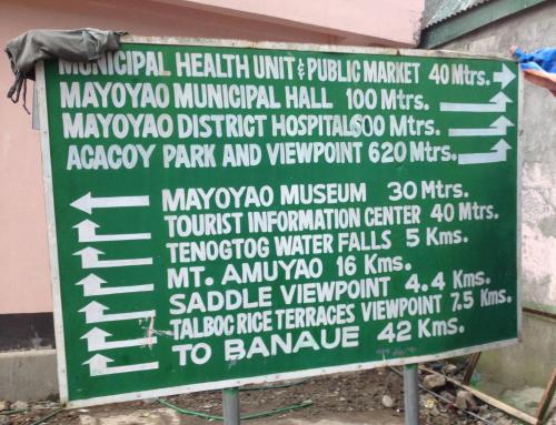 a sign in front of a building with words on it at Mayoyao View Inn in Banaue