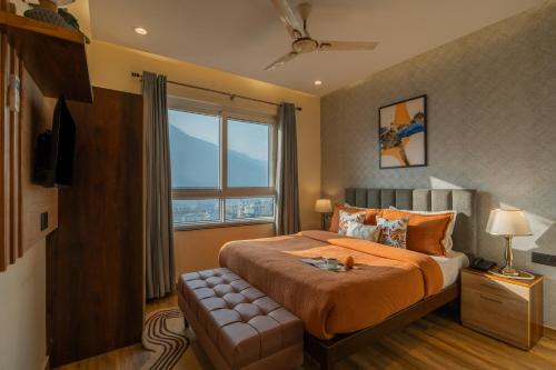 Ένα ή περισσότερα κρεβάτια σε δωμάτιο στο Perfectstayz Premium Pinaaki - Ganges View