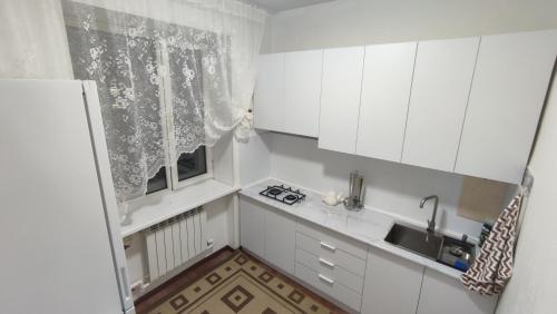 Η κουζίνα ή μικρή κουζίνα στο Люкс квартира