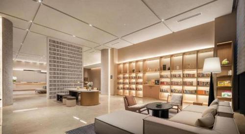 a living room with a couch and a table at Atour Hotel Chengdu High-Tech Zone in Chengdu