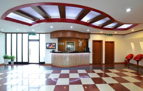 an office lobby with a checkered floor at Nova Motel in Boryeong