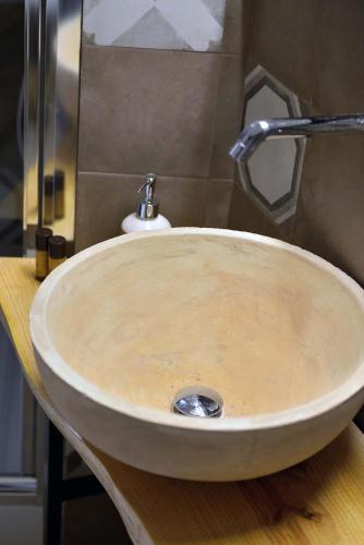 a sink with a faucet in a bathroom at Palazzo Kapece in Monopoli