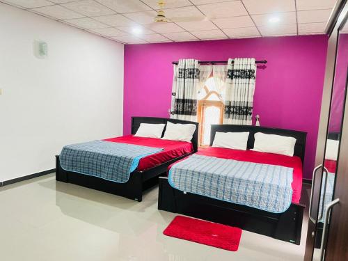 Ένα ή περισσότερα κρεβάτια σε δωμάτιο στο J City Holidays Inn