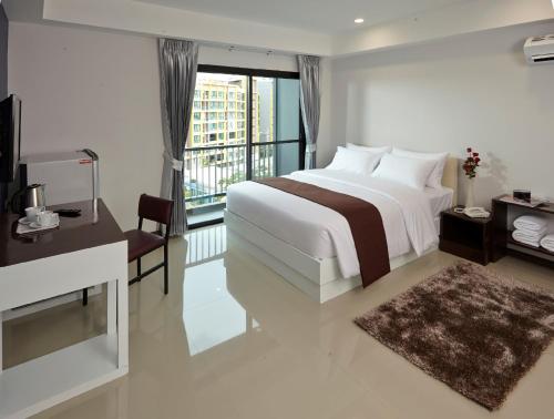 Llit o llits en una habitació de Casa Residence Hotel