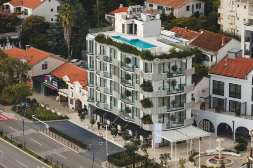an aerial view of a building in a city at Luminoso Boutique Hotel in Budva
