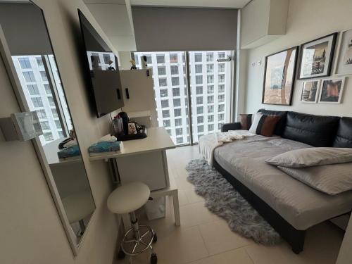 a bedroom with a large bed and a mirror at Only female ladies only Private room shared bathroom of a residential tower vs pool view & downtown view & pv rooftop parking minimum staying of 5 nights in Dubai