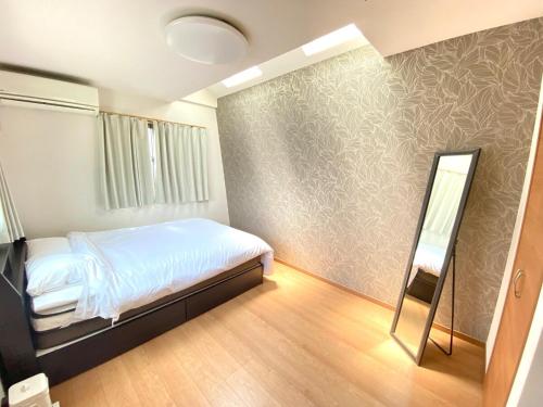 Postel nebo postele na pokoji v ubytování Hale 65 - Hale Collctions Tokyo