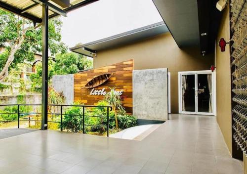 a lobby of a building with a balcony at LittleBoathostel in Ban Ko Khwan