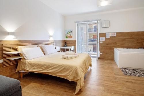 Ένα ή περισσότερα κρεβάτια σε δωμάτιο στο Jacuzzi - Il Centro Luxury Suites