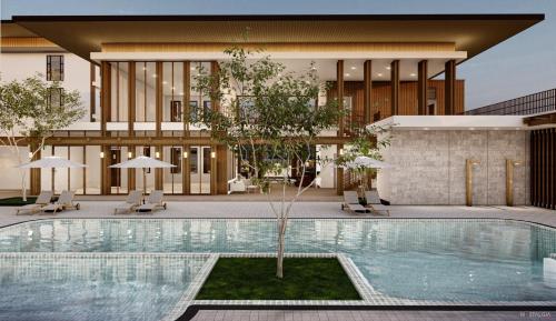 una piscina di fronte a un edificio di Whale Retreat Destination 